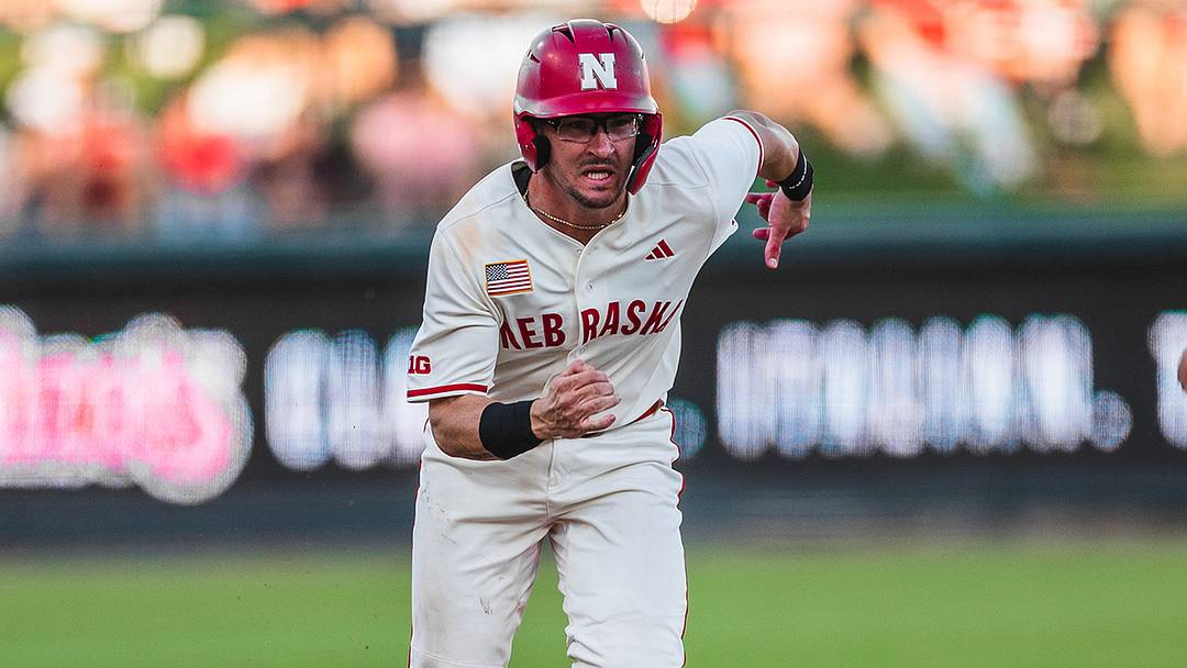 Nebraska catcher Trey Fikes races for home against Iowa. Nebraska catcher Trey Fikes races for home against Iowa.