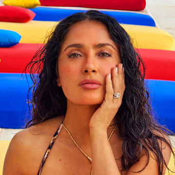 Salma Hayek Pinault was photographed by Ruven Afanador in Mexico. Swimsuit by Sommer Swim. Necklace by Jacquie Aiche.