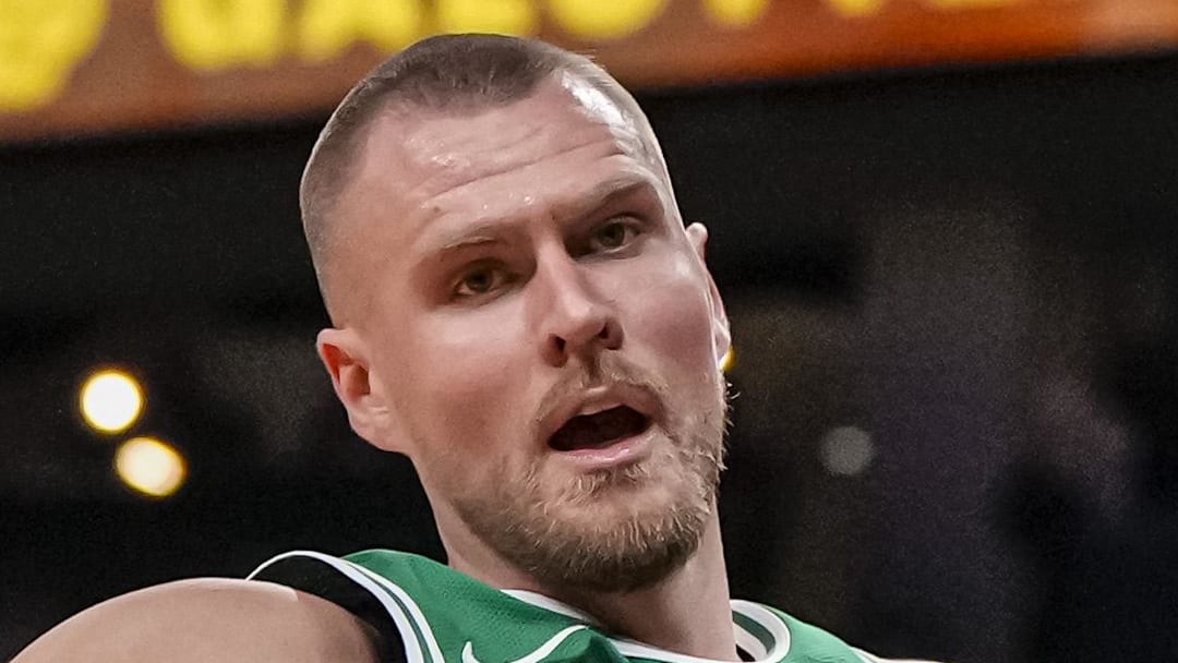 Mar 28, 2024; Atlanta, Georgia, USA; Boston Celtics center Kristaps Porzingis (8) dunks against the Atlanta Hawks during the first half at State Farm Arena. Mandatory Credit: Dale Zanine-Imagn Images