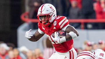 Nebraska running back Emmett Johnson runs for a short fourth quarter gain against Wisconsin.