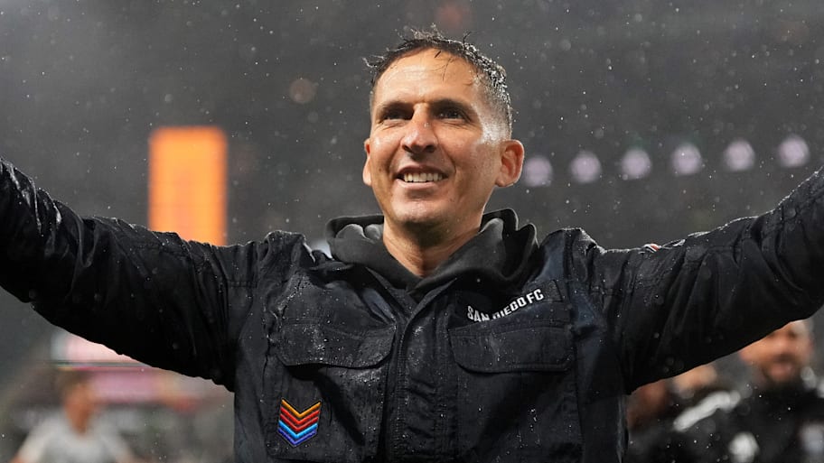 Mikey Varas with arms outstretched.