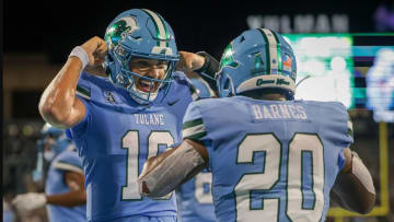 Tulane Green Wave quarterback Darian Mensah (10) celebrates with running back Arnold Barnes III (20) after a touchdown against the Southeastern Louisiana Lions during second half action at Yulman Stadium in New Orleans on Thursday, August 29, 2024.