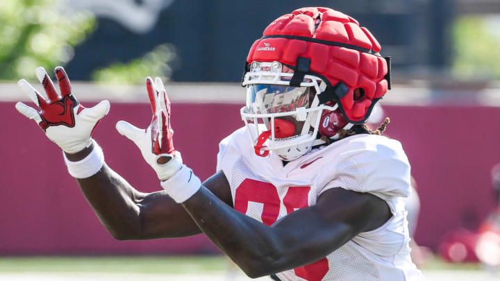 Arkansas Razorbacks wide receiver Davion Dozier prepares for reception during a 2023 practice. | Andy Hodges-Hogs on SI Images