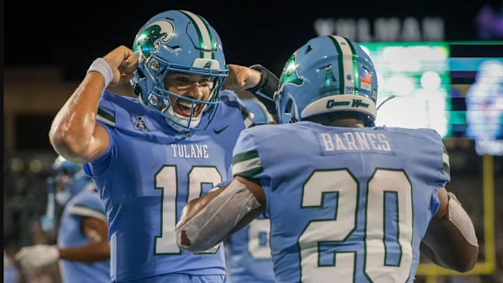 Tulane Green Wave quarterback Darian Mensah (10) celebrates with running back Arnold Barnes III (20) after a touchdown against the Southeastern Louisiana Lions during second half action at Yulman Stadium in New Orleans on Thursday, August 29, 2024.