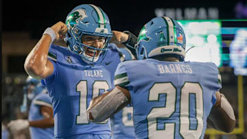 Tulane Green Wave quarterback Darian Mensah (10) celebrates with running back Arnold Barnes III (20) after a touchdown against the Southeastern Louisiana Lions during second half action at Yulman Stadium in New Orleans on Thursday, August 29, 2024.
