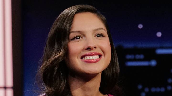 Olivia Rodrigo talks on a television broadcast