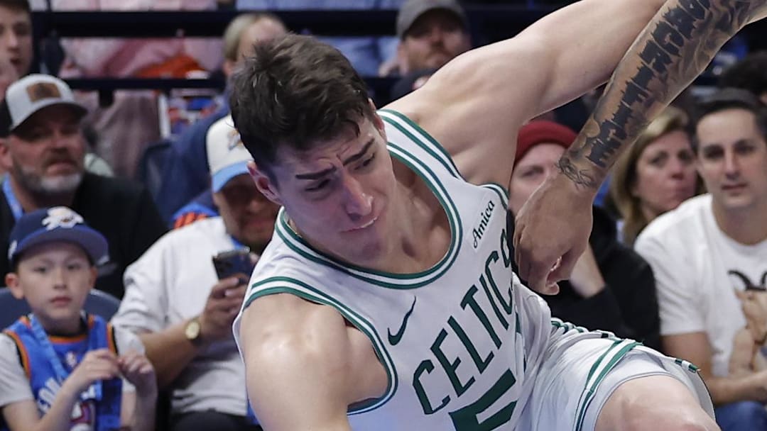 Mar 12, 2026; Oklahoma City, Oklahoma, USA; Boston Celtics center Luka Garza (52) and Oklahoma City Thunder forward Jaylin Williams (6) reach for a loose ball during the fourth quarter at Paycom Center. Mandatory Credit: Alonzo Adams-Imagn Images