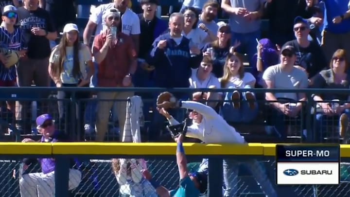 A fan interferes with a home run at Coors Field A fan interferes with a home run at Coors Field