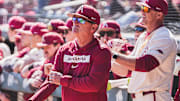 Arkansas coach Dave Van Horn looks on from the dugout against the Portland Pilots. The Razorbacks won the third game of the series 5-3. 