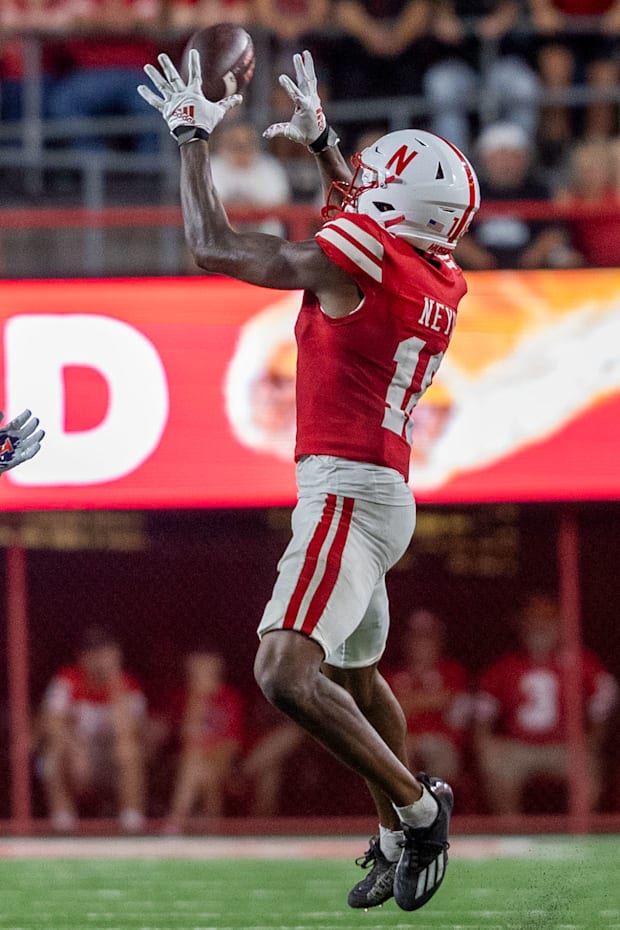 Nebraska wide reciever Isaiah Neyor catches a pass from quarterback Dylan Raiola against Illinois.