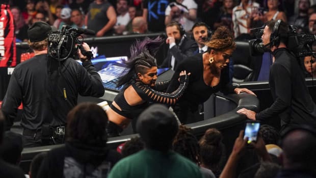 WWE Women's Champion Bayley sends Nia Jax into the barricade before their SummerSlam 2024 title match.