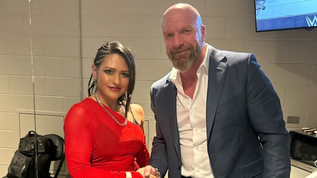 Giulia and WWE Chief Content Officer Paul "Triple H" Levesque.