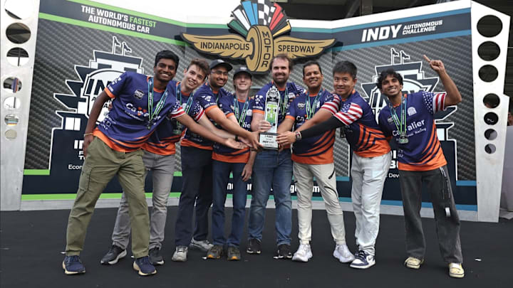 UVA's Cavalier Autonomous Racing team celebrates winning the speed trial portion of the Indy Autonomous Challenge at the Indianapolis Motor Speedway.