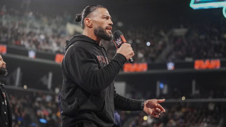 Roman Reigns cuts a promo during an episode of WWE Monday Night Raw.