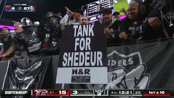 Raiders fans display a 'Tank for Shedeur' sign during Monday Night Football.