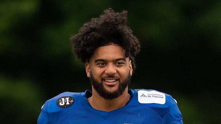 Indianapolis Colts defensive end Jaylahn Tuimoloau prepares for stretches