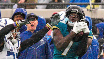 Jacksonville Jaguars wide receiver Brian Thomas Jr. (7) hauls in a pass as Indianapolis Colts cornerback Kenny Moore II (23) pressures him in the third quarter during an NFL football game at EverBank Stadium, Sunday, Dec. 7, 2025, in Jacksonville, Fla. Jaguars won 36-19. [Doug Engle/Florida Times-Union]