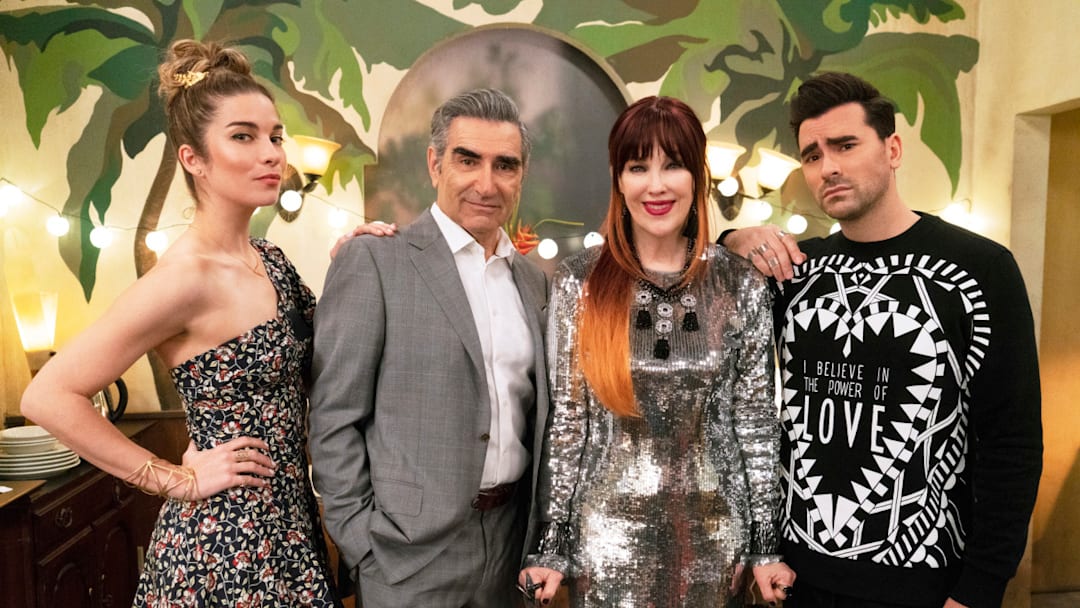 Schitt's Creek -- "Meet the Parents" -- Image Number: SCH511_0119.jpg -- Pictured (L-R): Annie Murphy as Alexis Rose, Eugene Levy as Johnny Rose, Catherine OHara as Moira Rose and Daniel Levy as David Rose -- Photo: 2020 Pop Media Group LLC.