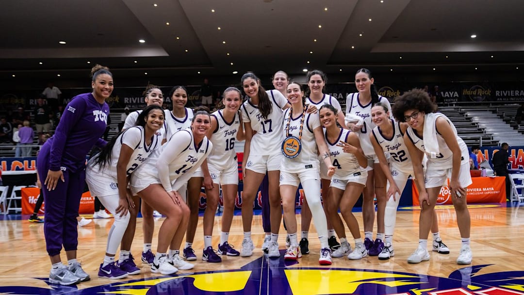 The TCU Horned Frogs women's basketball team celebrates after their win over the UAB Blazers in the Cancun Challenge.