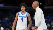 Former Memphis guard PJ Haggerty (4) talks to his coach during a game in Memphis, Tenn. at FedExForum. Mandatory Credit: Chris Day/The Commercial Appeal