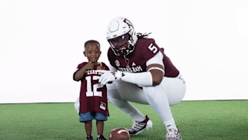 Five-star 2026 prospect Lamar Brown poses in a Texas A&M uniform.