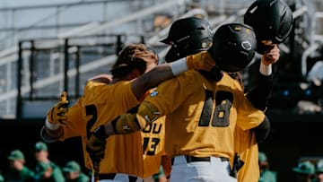 The Missouri Tigers Baseball team huddles together during a game against the Binghamton Bearcats.
