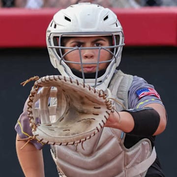 High school softball catchers will now be able to receive one-way communication from their coaches, while on defense, under new rules announced Monday by the NFHS.