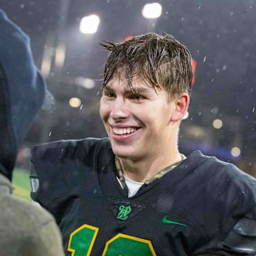 QB Sam Leavitt had a lot to smile about after leading West Linn to an Oregon high school football state title in 2022.