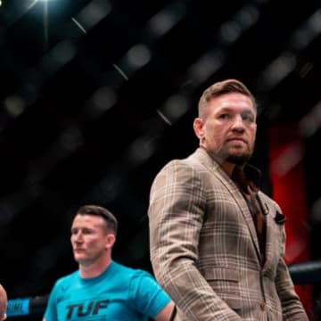 Conor McGregor and Michael Chandler are inside the Octagon during filming for season 31 of "The Ultimate Fighter."