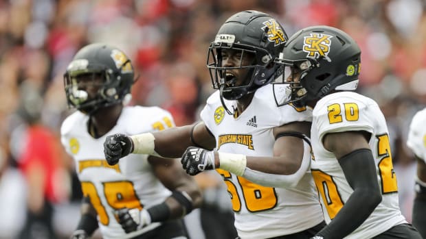 Kennesaw State Owls football players celebrating.