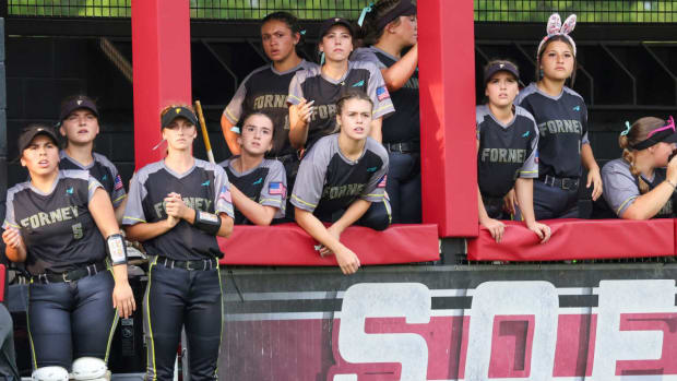 Forney (Texas) players look on from their dugout against Melissa in the UIL 5A Region 2 softball championship series. 