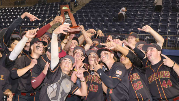 Torrey Pines (Calif.) players hoist the championship trophy while taking a selfie following their victory over Rancho Bernardo in the CIF San Diego Section Open Division title game at Flower Park on the campus of University of San Diego.