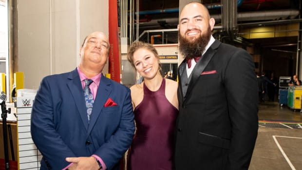 Ronda Rousey with Paul Heyman and her husband Travis Browne