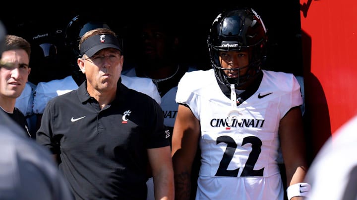 Cincinnati Bearcats head coach Scott Satterfield and Cincinnati Bearcats linebacker Jonathan Thompson (22) prepare to take the field before the College Football game against the Miami Redhawks at Yager Stadium in Cincinnati on Saturday, Sept. 14, 2024.