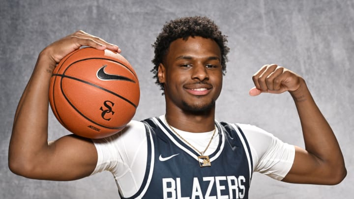 LA Lakers rookie Bronny James flexes during a 2022-23 preseason photo shoot at Sierra Canyon Basketball Media Day.