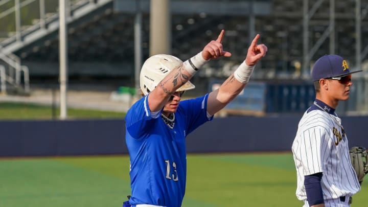 Max Clark gestures to his Franklin Community High School (Indiana) teammates after a hit.