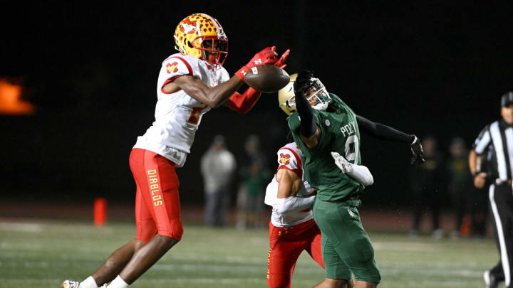 Mission Viejo defensive back Dijon Lee, left, has committed to play college football for the Alabama Crimson Tide.