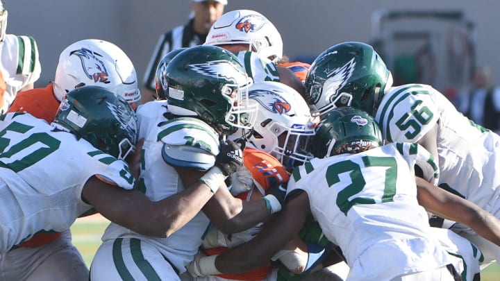 The Collins Hill (Georgia) defense swarms Graham-Kapowsin (Washington) in the 2021 high school football national championship game.