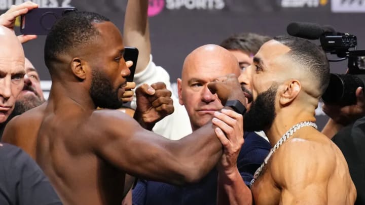 UFC Welterweight Champion Leon Edwards and Belal Muhammad stare down at the UFC 304 ceremonial weigh-ins.