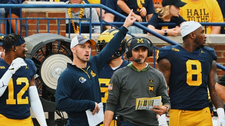 Connor Stalions signals from the sideline