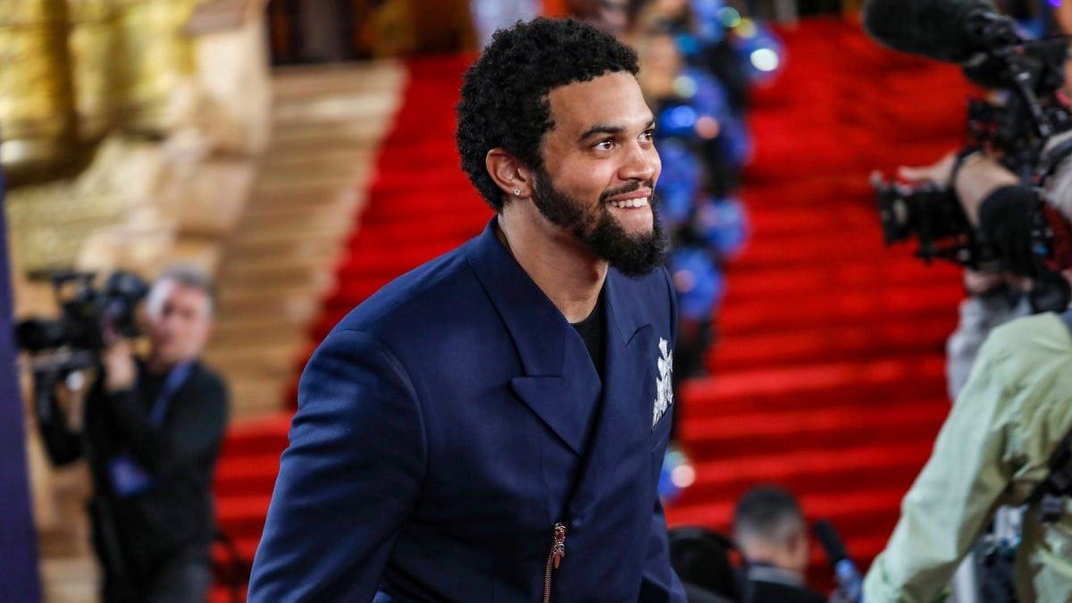 Caleb Williams walks the red carpet for NFL Draft day at the Fox Theatre in Detroit. 