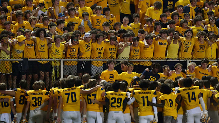 Fans serenade Archbishop Moeller players during a game against St. Xavier.