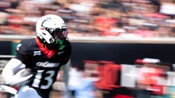 Cincinnati Bearcats kick returner Logan Wilson (13) runs downfield in the first quarter of the College Football game at Nippert Stadium in Cincinnati on Saturday, Sept. 21, 2024.