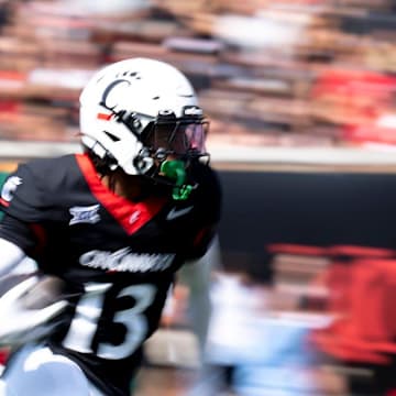 Cincinnati Bearcats kick returner Logan Wilson (13) runs downfield in the first quarter of the College Football game at Nippert Stadium in Cincinnati on Saturday, Sept. 21, 2024.