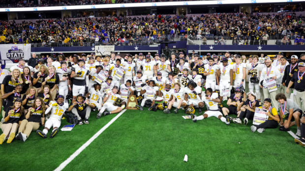 Malakoff poses after winning the UIL (Texas) 3A Division I state championship in December at AT&T Stadium. 