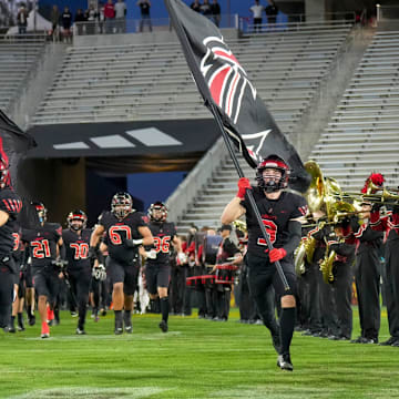 Peoria Liberty takes the field in the 2023 Arizona high school football state championship game against Centennial.