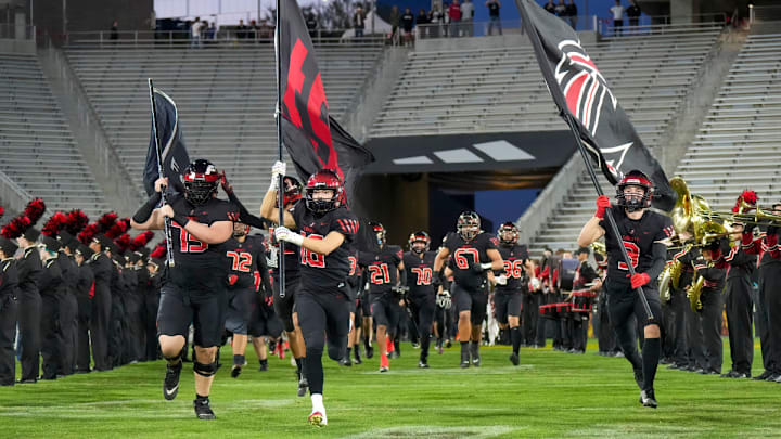 Peoria Liberty takes the field in the 2023 Arizona high school football state championship game against Centennial.