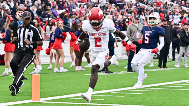 North Shore's Christopher Barnes crosses the endzone plane with a sprinter finish in a Texas high school district football win over Atascocita in 2023.