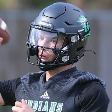 QB Tamen Zabetakis works in passing drills during a Choctaw Indians football practice.