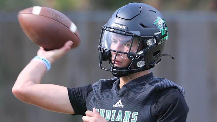 QB Tamen Zabetakis works in passing drills during a Choctaw Indians football practice. QB Tamen Zabetakis works in passing drills during a Choctaw Indians football practice.